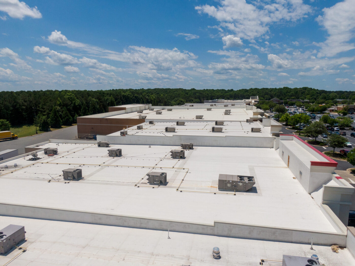 Drone Images of Commercial Roofs Featuring TPO and Asphalt Shingles: Midday, Sunny, No People