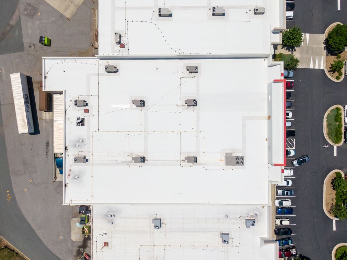 Drone Images of Commercial Roofs Featuring TPO and Asphalt Shingles: Midday, Sunny, No People