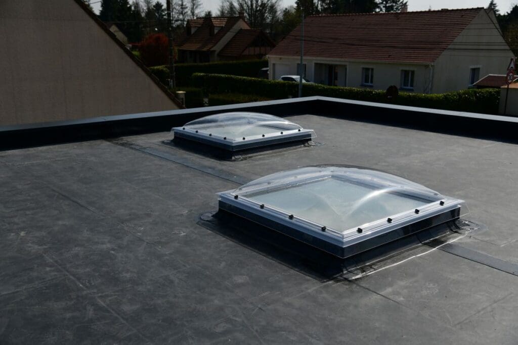 epdm roofing black roof surrounded by house windows