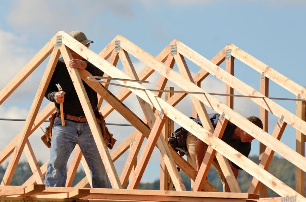 roof trusses workers building structure