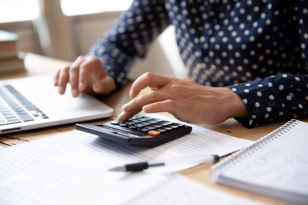 commercial roof financing man using calculator