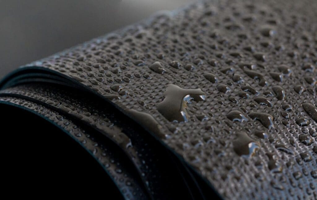 rubber roofing close up membrane water drops