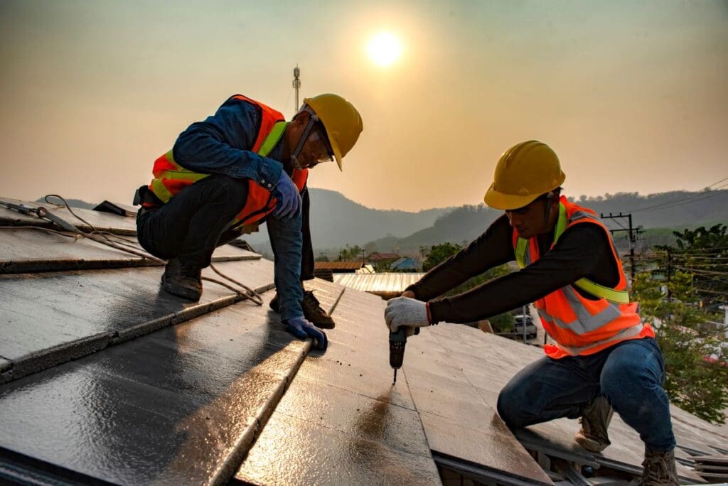 how to repair flat roof felt workers using gun to repair roof