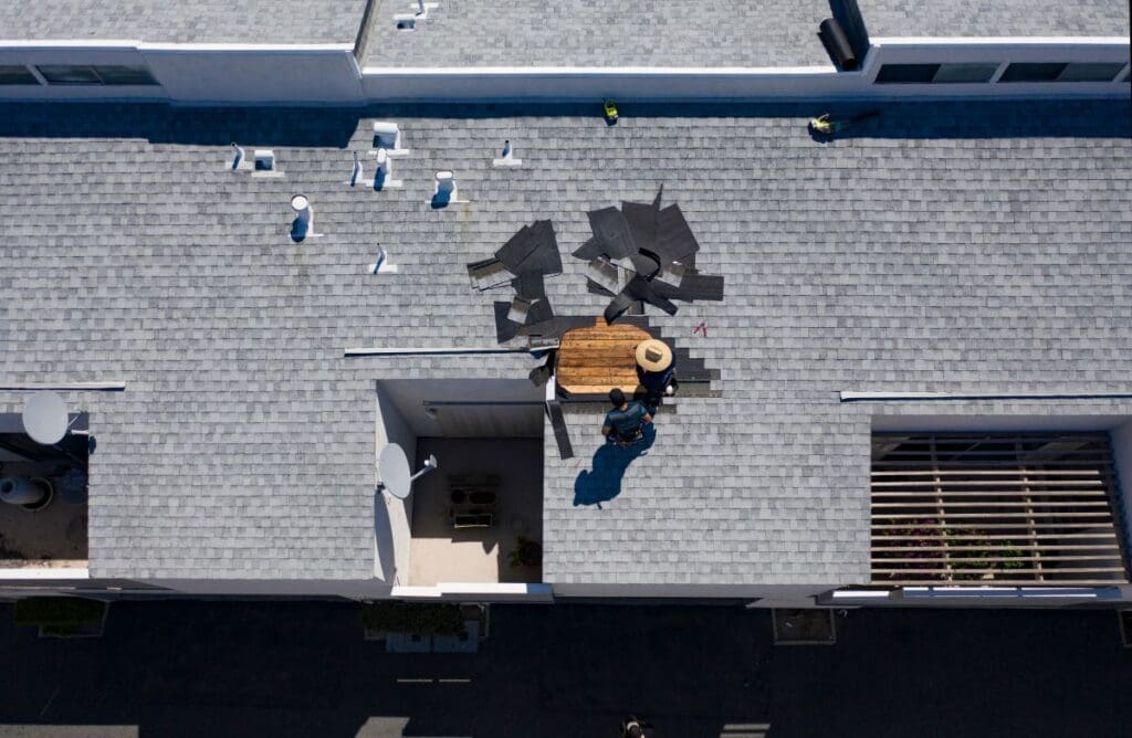 how to repair flat roof felt workers replacing shingles roof