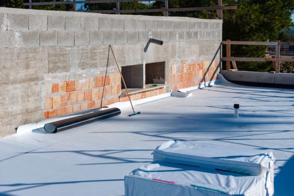 tpo roofing maintenance rollers brush on top of roof