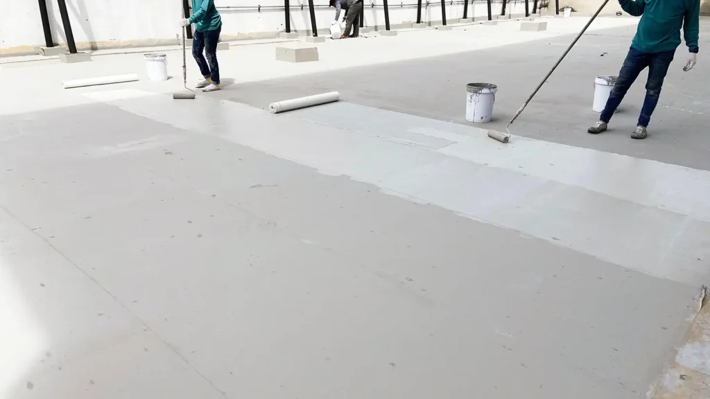 silicone roof coating guys applying coat