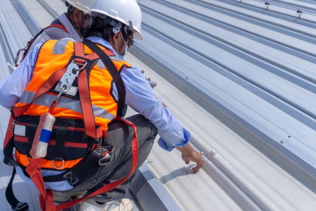 best metal roof sealant workers using helmet
