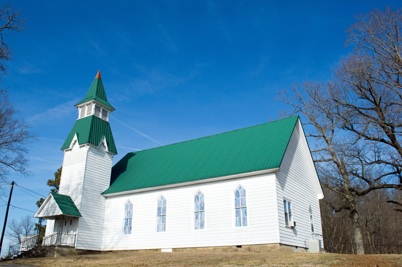 small church with green metallic roof