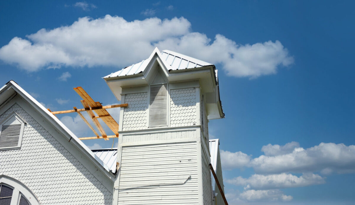 Old church in Lamar, Arkansas, gets a new tin roof. Church is destined to become an event center.