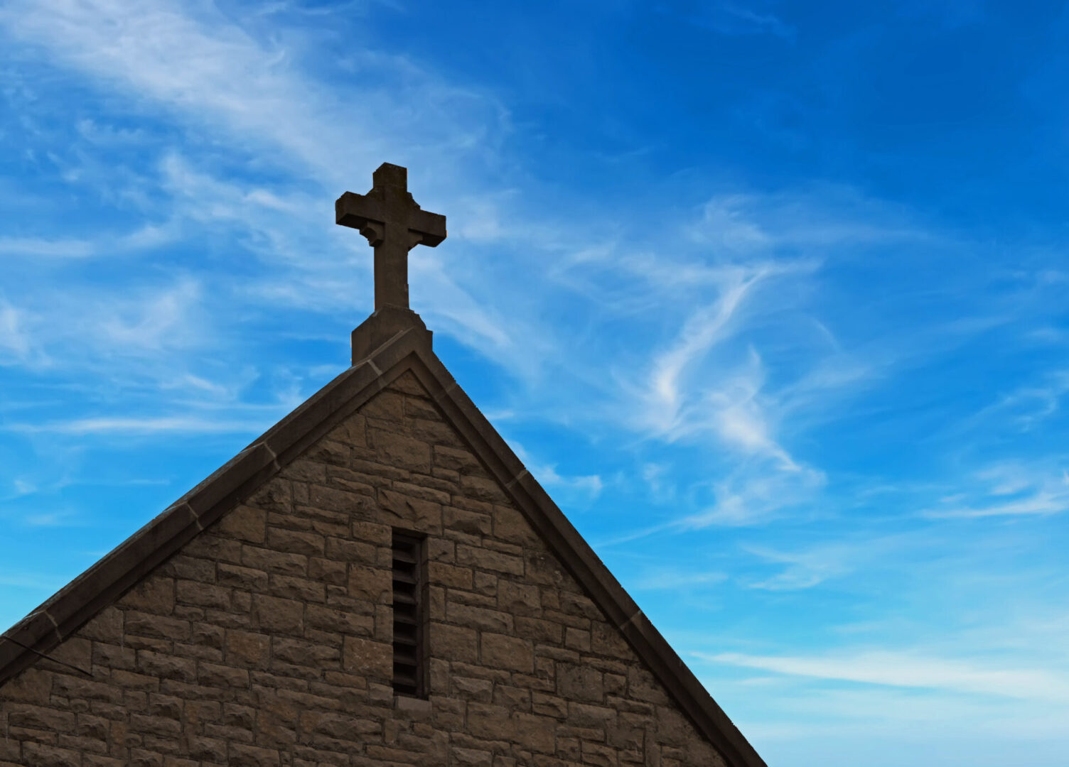 cross on the top of a church church roofing morristown nj