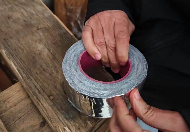 hand holding rubber tape