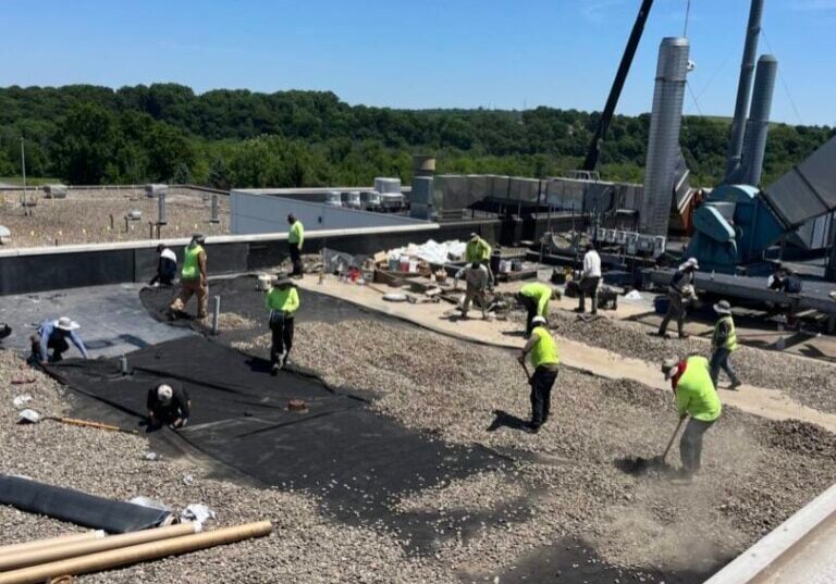 asphalt flat roof repair Weathertite workers repairing asphalt