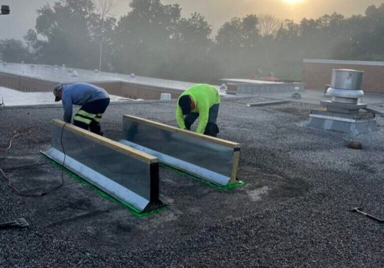 how to repair flat roof felt workers installing something