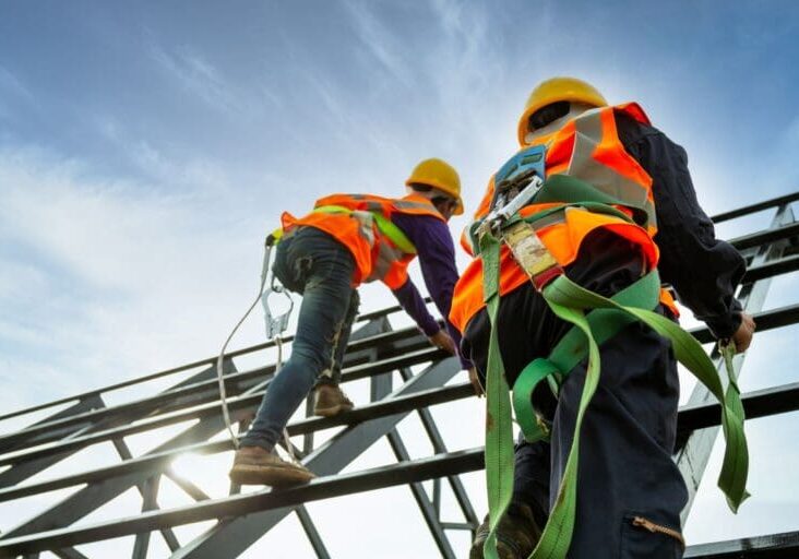 abc step safety award workers standing on structure using helmet