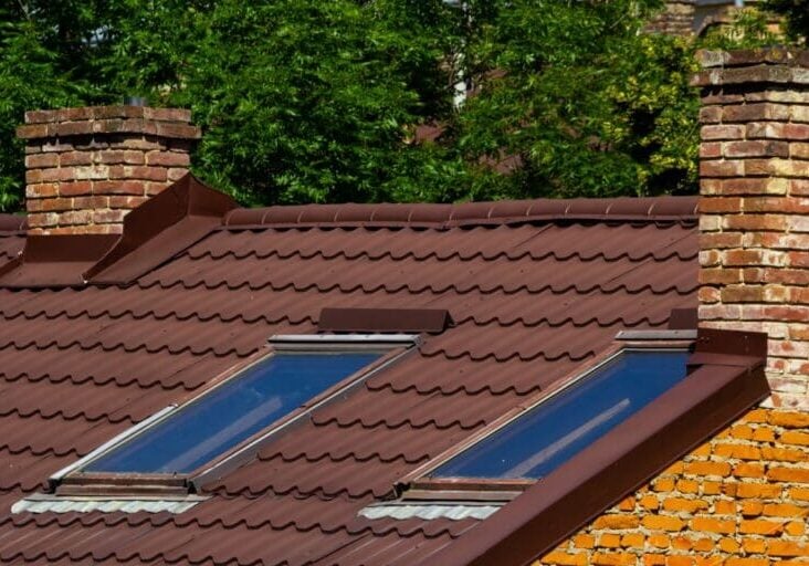 metal roof flashing brick wall brown corrugated roof