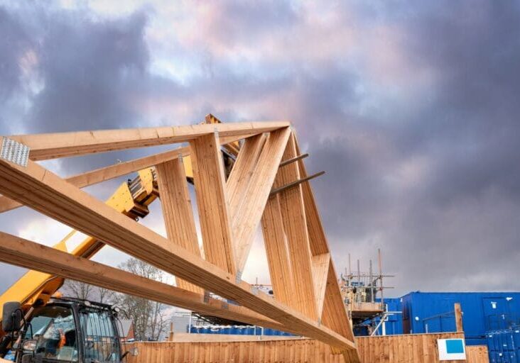 roof trusses grey sky wooden structure commercial building